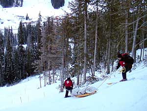 Mike Henness schlepped by ski patrol at Sun Peaks, Canada, 2005.