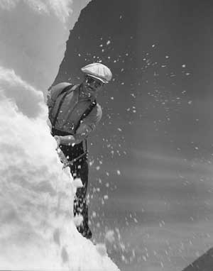 Man carving snow